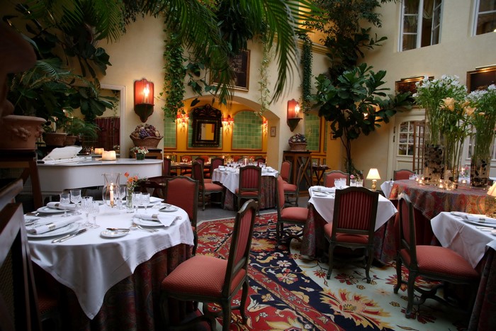 Restaurant interior with tables and plants