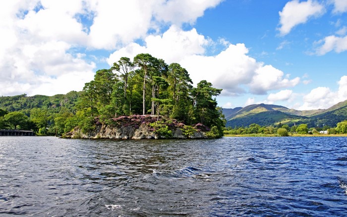 Island with trees on Windermere lake, United Kingdom