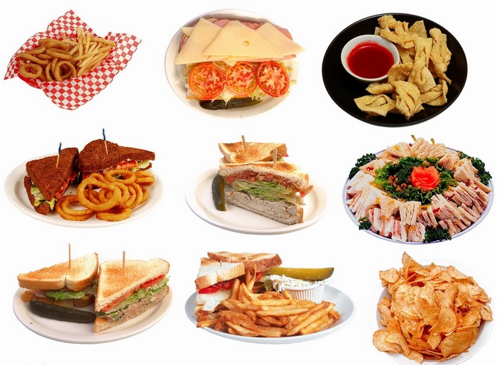 Assortment of sandwiches, fries, onion rings, and chips
