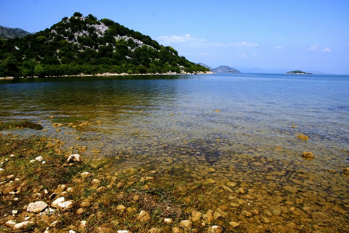 Lake with a tree-covered hill and islands