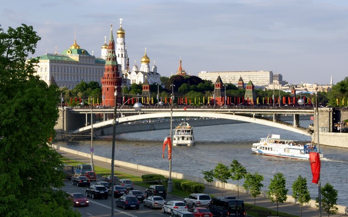 Moscow Kremlin and Moskva River with boats and bridge
