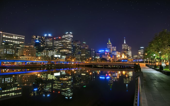 Melbourne skyline at night with Yarra River reflections
