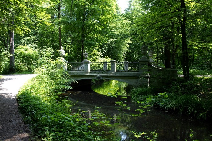 Stone bridge over a stream in Nymphenburg Park, Munich