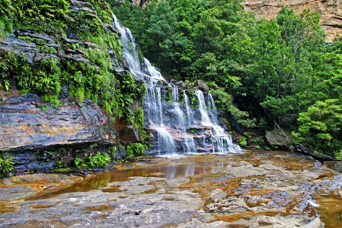 Waterfall cascading down a rocky cliff face