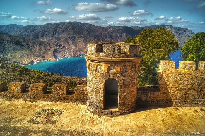 Castle tower overlooking a bay in Spain