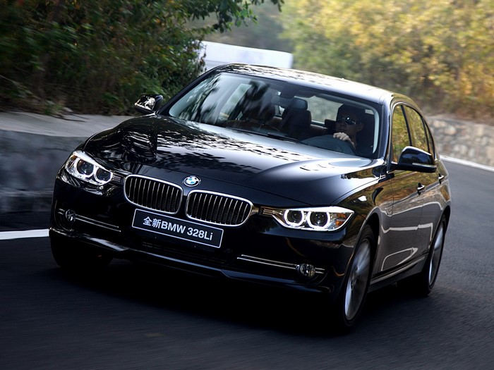 Black BMW 328Li driving on a road