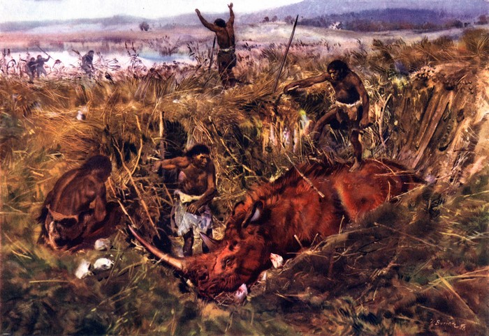 Prehistoric hunters with spears and clubs surrounding a dead rhinoceros