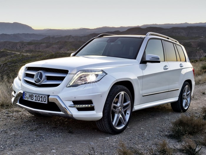 White Mercedes-Benz GLK SUV on a dirt road