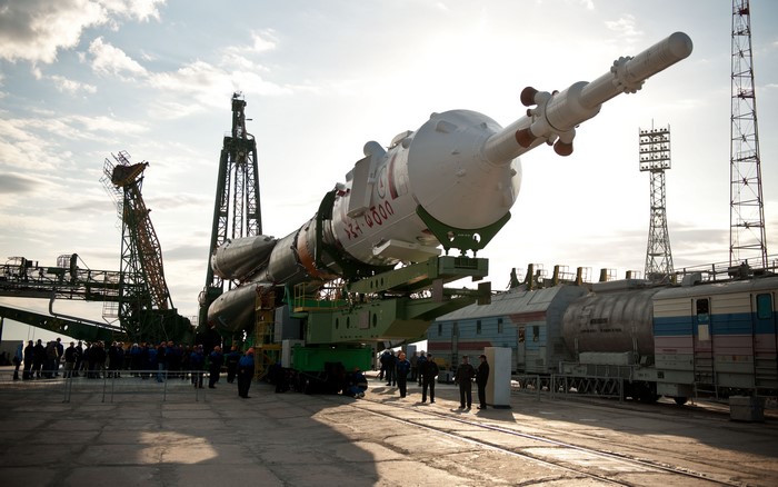 Soyuz rocket on launchpad with launch towers
