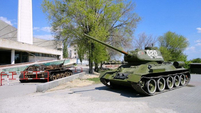 T-34 tanks on display near a building