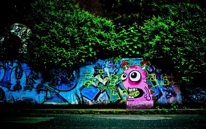Graffiti on a wall with a cartoon monster