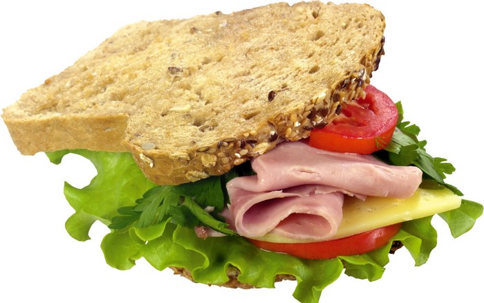 Sandwich with ham, cheese, lettuce, tomato, and bread