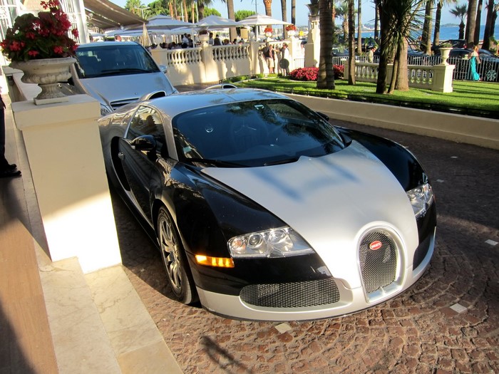 Bugatti Veyron parked outside a building