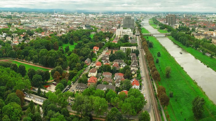 Aerial view of a German city with a river and park