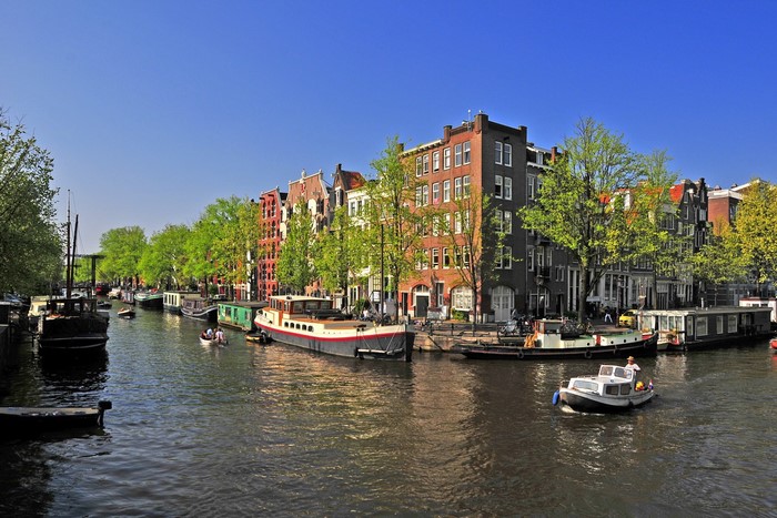 Amsterdam Canal with Boats and Buildings