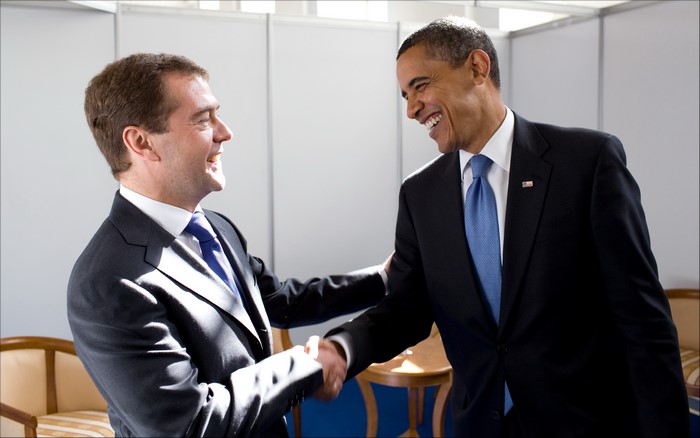 Dmitry Medvedev and Barack Obama shaking hands and laughing