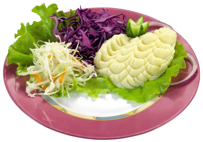 Mashed potatoes with salad on a plate