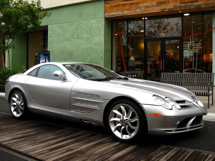 Silver Mercedes-Benz SLR McLaren parked on wooden planks