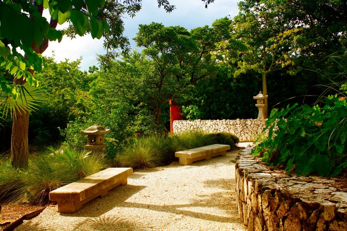 Japanese Garden in Miami with Stone Benches and Lanterns