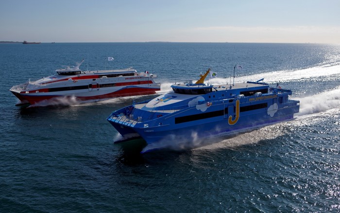 Two ferries, Liberty and another, sailing on the sea