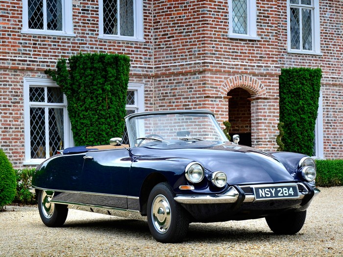 Dark Blue Citroën DS Convertible in front of Brick House