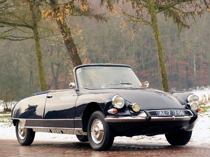 Dark blue Citroen DS convertible parked on a wet road