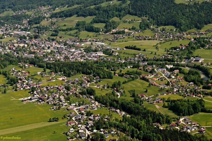 Aerial view of a town in Austria with rolling green hills