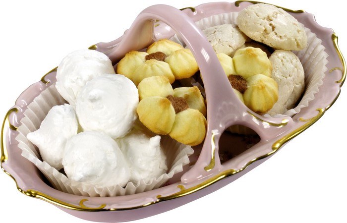 Pink ceramic basket with assorted cookies and meringues