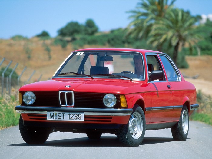 Red BMW 320i E21 on a road