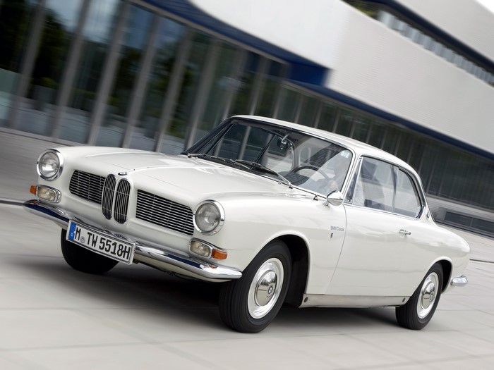 White BMW Classic Coupe driving on a street
