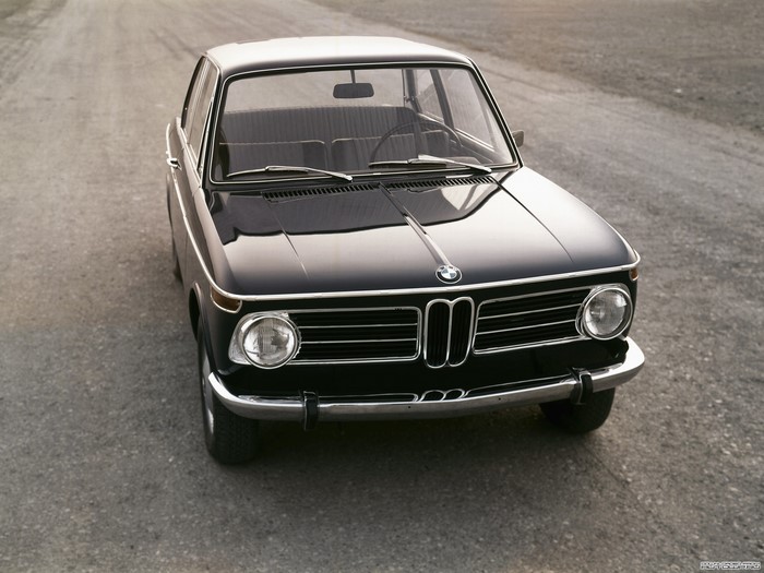 Black BMW 2002 parked on a dirt road