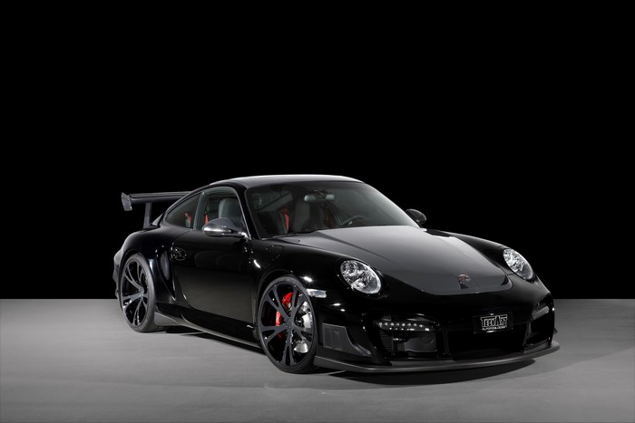 Black Porsche 911 GT3 RS with a large rear spoiler