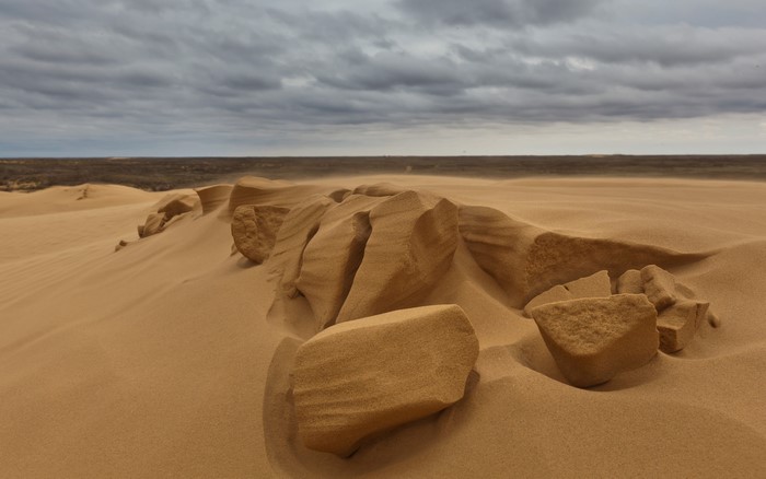 Sand dunes and rocks in a desert landscape