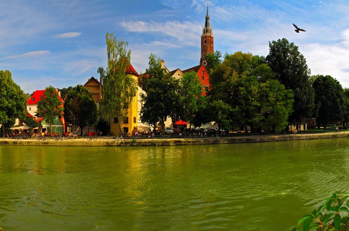 Riverfront buildings and church tower in Germany