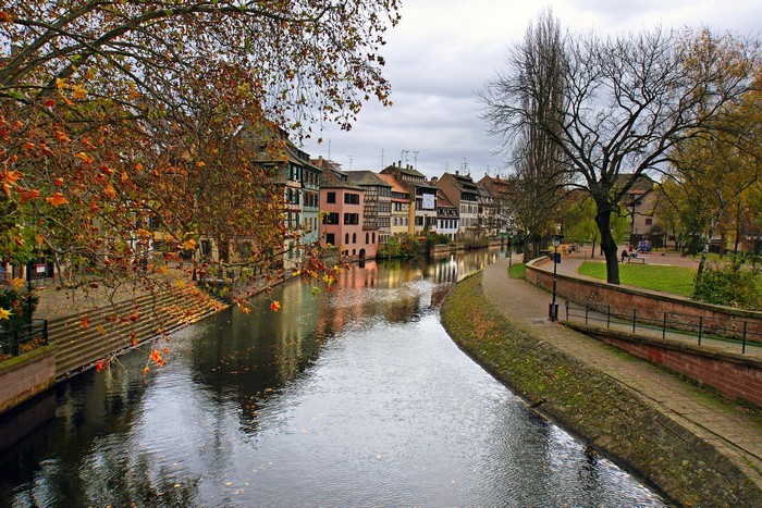 River and buildings in Strasbourg, France during autumn