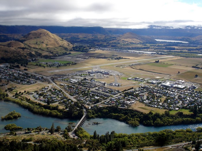 Aerial view of Queenstown, New Zealand with airport and lake