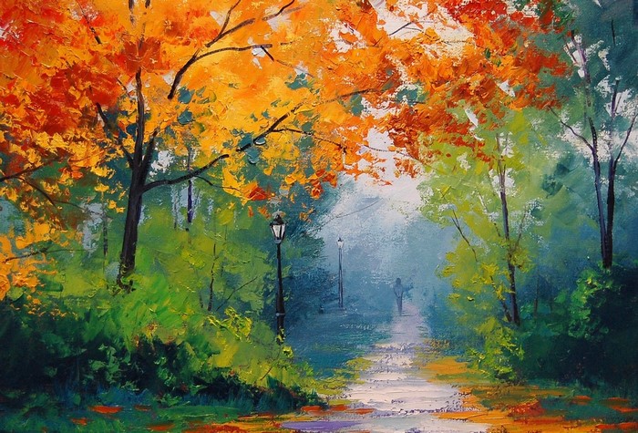 Autumn park path with lampposts and a distant figure