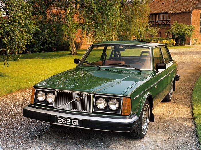 Green Volvo 262 GL parked on gravel driveway