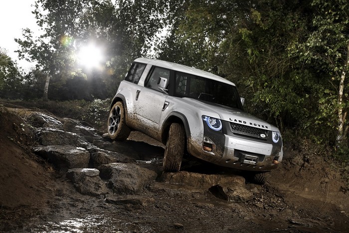Land Rover Defender driving on rocky terrain