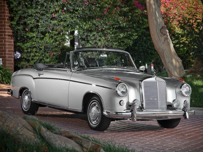 Silver Mercedes-Benz Convertible parked on brick driveway