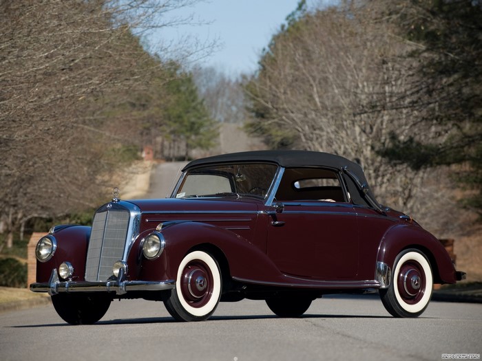 Maroon Mercedes-Benz convertible parked on a road