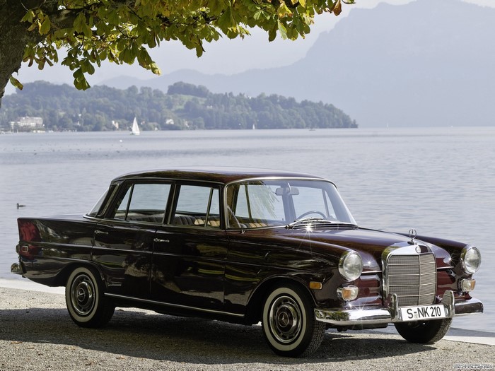 Mercedes-Benz car parked by a lake