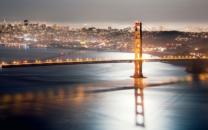 Golden Gate Bridge at night with San Francisco skyline