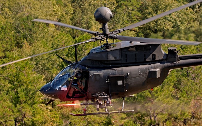Black military helicopter in flight