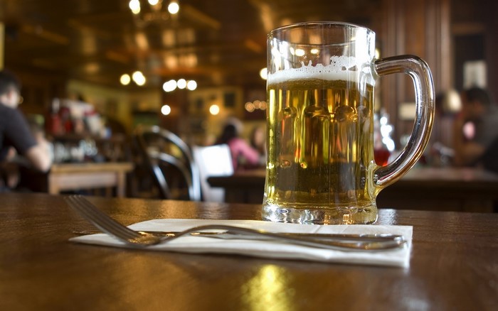 Beer in a mug on a table in a restaurant