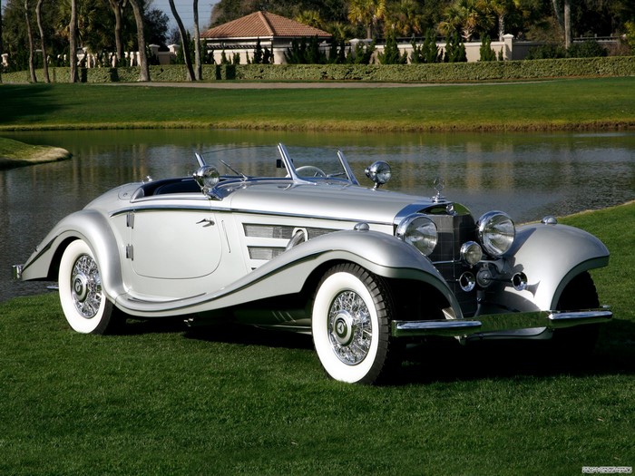 Silver Mercedes-Benz 540K Roadster on a golf course