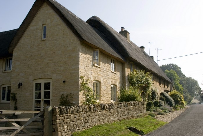 Thatched roof stone cottage in the United Kingdom