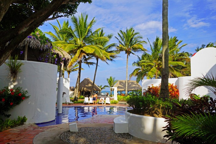 Resort with palm trees and swimming pool