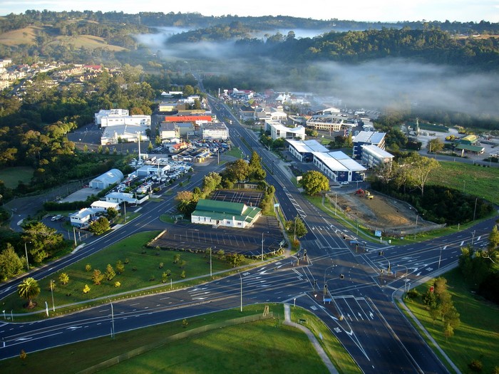 Aerial view of a town in New Zealand with morning mist