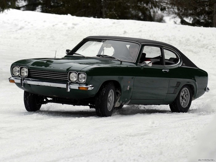Green Ford Capri driving on snow